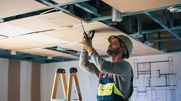 construction worker assemble suspended ceiling with drywall fixing drywall ceiling (1)